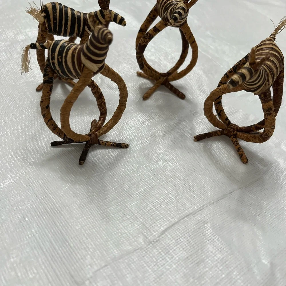 Four hand woven napkin holders